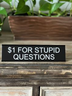 "😂 FUNNY DESK SIGNS - Reads $1 For Stupid Questions. Lotsa Laughs funny desk plates are sure to be the conversation piece of your work space. 🇺🇸 DESIGNED AND PRODUCED IN USA - UV resistant indoor/outdoor plastic, design and labor is from the USA. Designed, engraved and assembled in Ohio, USA by Griffco Supply. 🪧 QUALITY SIGN AND THE PERFECT SIZE: Measures 2\"x8\" and comes with a solid aluminum desk holder. 🤣 GIVE THE GIFT OF LAUGHTER: The perfect gift for any occasion. We are pretty sure this gift will make you the recipient's favorite person on earth (not guaranteed). Our funny desk signs make great ice breakers and can reduce the tension in the office. Everybody loves a little chuckle. 🛒 TONS OF SIGN OPTIONS: Check out our other Lotsa Laughs desk plates. This growing line of novel Office Signs Funny, Funny Signs For Work Desk, Sarcastic Office Signs, Funny Cubicle Signs, Funny Desk Name Plates, Diy Laser Engraver, Letterboard Signs, Desk Plates, Funny One Liners