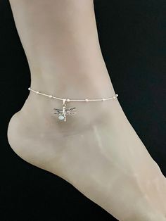 "Natural Larimar Dragonfly Anklet, Sterling Silver Beaded Ankle Bracelet Larimar Dragonfly Ankle Chain ANKLET FEATURES: Metal: All components are made from solid .925 Sterling Silver Model is wearing 10\" in length solid .925 Sterling Silver Rolo Bead Chain Chain Length: 9 inch + 1 inch extension Please send me a message if you have any questions before or after placing your order. Please also view my policy before purchasing. Please visit my storefront to view more of my creations: vonzjewel.et Ankle Bracelets Silver, Dragonfly Anklet, Beach Wedding Jewelry, Dragonfly Bracelet, Beaded Ankle Bracelets, Silver Model, Beaded Ankle, Heart Anklet, Summer Anklets