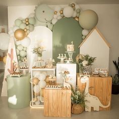 a room filled with lots of different types of decorations and balloons on the wall behind it