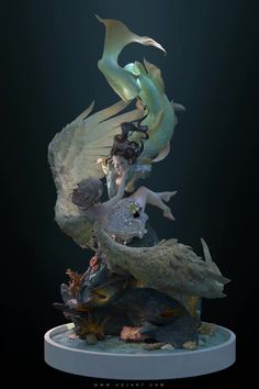 the statue is on display in front of a black background, with an image of mermaids and other sea creatures