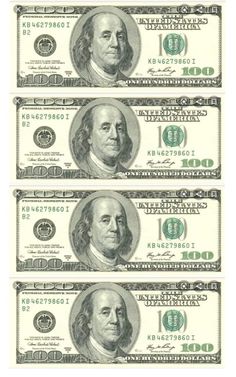 three stacks of one hundred dollar bills