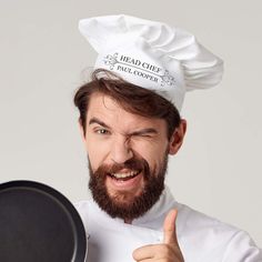 So, your prying hands have been spatula-slapped enough for you to know that you aren’t the boss of the kitchen. But, the culinary genius who IS boss still doesn’t look the part. That’s why you need to give them this personalised Head Chef's Hat! Modelled on the hats worn by professional chefs and fancy fried chicken drumsticks, this chef’s hat is a floofy poof of white on a headband… that is conveniently sized to fit most heads. And, best of all, you can personalise this chef’s hat with 14 characters of text! That’s enough for a name or a short message (that you can use to let the chef know exactly what you think of them). So, for a hat that’s dripping with as much exquisite taste as the food it’ll reign over, order this personalised Head Chef’s hat today! Tv Gift, Funny Gifts For Him, Chef Hat, Man Cave Gifts, Chefs Hat, Personalised Gifts For Him, Fitness Gifts, Top Chef, Gifts For Cooks