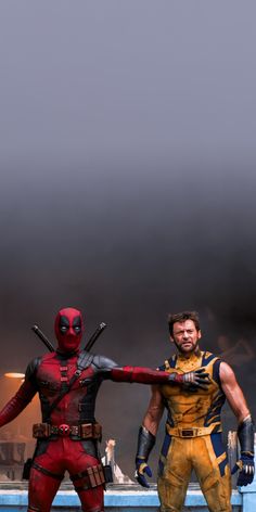 two deadpools standing next to each other