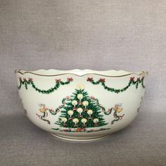 a white bowl with a christmas tree on it