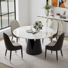 a white table with four chairs around it