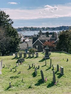 an old cemetery with many headstones in the grass