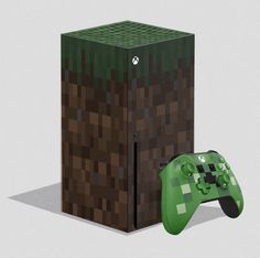 a video game controller next to a cardboard box with an image of a creeper on it