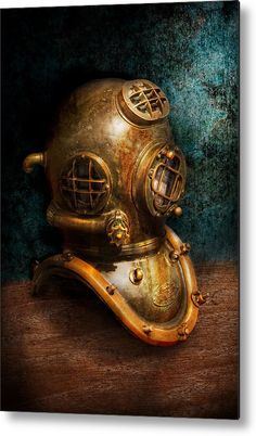 an old diving helmet on top of a wooden table