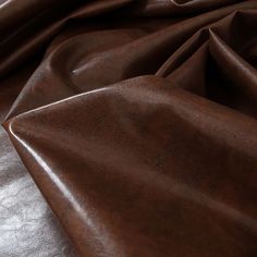 a close up view of a brown leather material