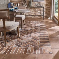 a dining room with a brick wall and wooden flooring