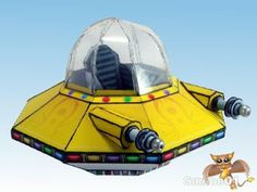 a paper model of a yellow spaceship that is floating in the air with a cat next to it