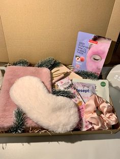 a box filled with pink and white items