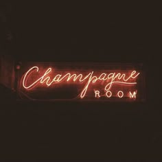 a neon sign that reads champagne room