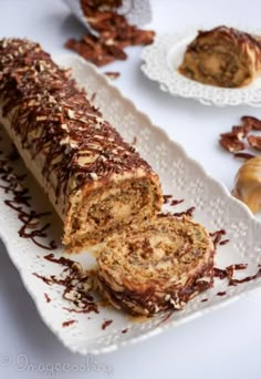 a white plate topped with chocolate covered pastry