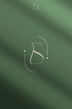 the letter j is made up of white lines on a green background with an elegant monogram