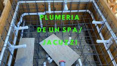 the inside of a building with scaffolding around it and words that read plumeria de un spa / jacuzzi