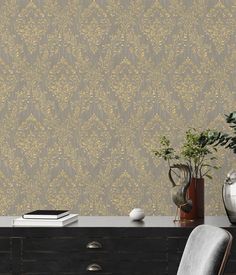 an elegant wallpaper design with gold leafy leaves on grey and beige background, in a living room