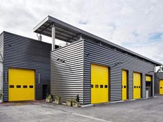 two garages with yellow doors in front of them