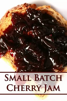 small batch cherry jam on a piece of bread with the words, small batch cherry jam