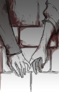 two hands holding each other over a table