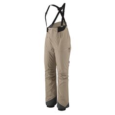 a pair of ski pants with suspends on the legs and one leg in beige