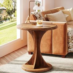 a living room scene with focus on the end table and sofa in the back ground