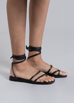 Color: Black Soft leather sandal Wrap around ankle strap Front toe detailing Padded insole Low platform 100% Leather Upper Leather Outsole By Mari Giudicelli. Made in Brazil Mari Giudicelli, Soft Leather Sandals, Birkenstock Mayari, Made In Brazil, Wrap Around, Black Sandals, Leather Sandals, Birkenstock, Soft Leather