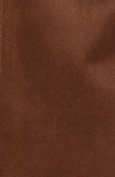 an image of a brown background that looks like suede fabric or leather with no pattern