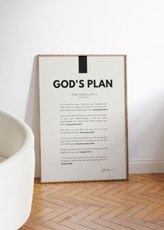 a white chair sitting in front of a poster on the wall that says god's plan