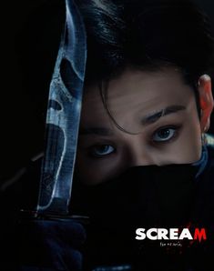 a woman holding a knife in front of her face with the words scream on it