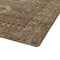 a brown rug with an intricate design on it