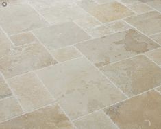 a white toilet sitting on top of a tiled floor