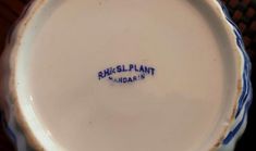 a blue and white porcelain bowl with writing on the bottom that says, rosell plant indiana