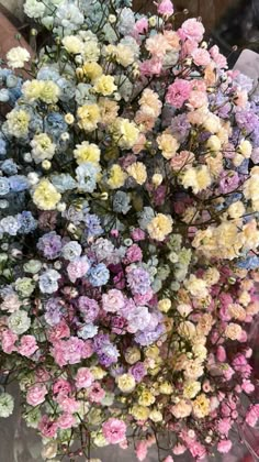 a bunch of flowers that are sitting on a table