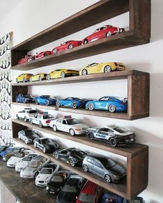 there are many toy cars on the shelves