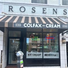 an ice cream shop on the corner of a street