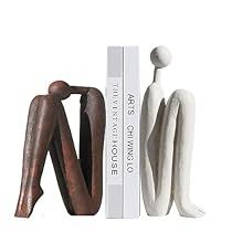 two white and brown figurines next to each other on a white background with the word love written below them