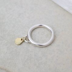 Teardrop charm silver ring | Dainty charm rings | Minimalist charm rings | Recycled silver ring | Dangle charm ring | Gift for mother's day | all rings sizes | Handmade rings This Golden Teardrop ring is built with an 18k gold plated and silver. The gold is recycled scrap from other projects, melted down, and forged into shape with multiple hammers and files. I love the softly hammered texture, and not too shiny finish. The teardrop has a really great weight to it and of course the movement. If Minimalist Heart Charm Ring For Everyday, Minimalist Heart Charm Ring As Gift, Ring With Dangling Charm, Silver Rings With Heart Charm For Gift, Adjustable Gold Ring With Heart Charm, Friendship Day Gifts, Engagement Presents, Gifts For My Girlfriend, Teardrop Ring