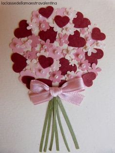 a bouquet of pink and white flowers with hearts