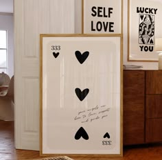 two framed art pieces with hearts on them