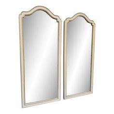 a pair of mirrors sitting next to each other