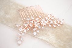 - Created with Premium Cubic Zirconia stones - Available in rose gold, yellow gold, and rhodium finish - Hair comb measures 3.5 inches x 2 inches - Nickel free and hypoallergenic Browse My Entire Shop For More Jewelry & Accessories: https://www.etsy.com/shop/TheExquisiteBride Browse My Shop For Earrings: https://www.etsy.com/shop/TheExquisiteBride?section_id=14483895 Browse My Shop For Bracelets: https://www.etsy.com/shop/TheExquisiteBride?ref=seller-platform-mcnav&section_id=14486145 Browse My Rose Gold Hair Piece, Wedding Jewelry Simple, Gold Hair Piece, Gold Bridal Hair Comb, Wedding Earrings Chandelier, Rose Gold Bridal Earrings, Gold Hair Comb, Hair Comb Bridal, Bridal Hair Piece