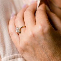 a close up of a person wearing a ring