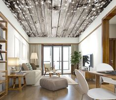 a living room filled with furniture and a ceiling covered in stars on wood planks