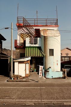 an old building is painted blue and white