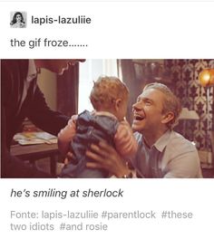 a man holding a small child in his lap and laughing at him with the caption that says, he's smiling at sherlock