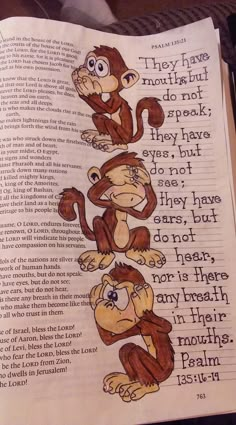 an open bible with three monkeys sitting on top of it and the words they have in them