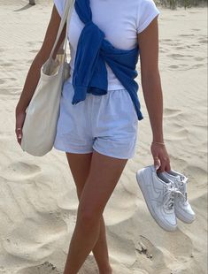 White Blue Striped Pants Outfit, Light Blue Shorts Outfits Women, Trendy Style Outfits 2024, So Cal Aesthetic Outfits, Blue And White Shorts Outfit, Blue Shirt With White Stripes Outfit, Blue Bags Outfit, Blue Striped Pants Outfit Summer, Cardigan Tied Around Shoulders Outfit