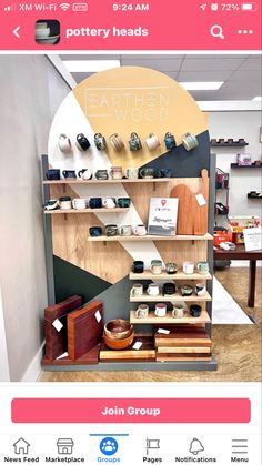 a display case filled with lots of items on top of a wooden shelf next to a wall