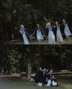 several people are posing for pictures in front of some trees and one is holding the other's hand